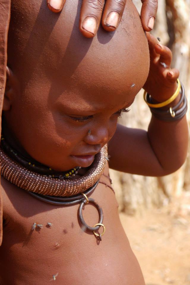 Himba Child swatting flies