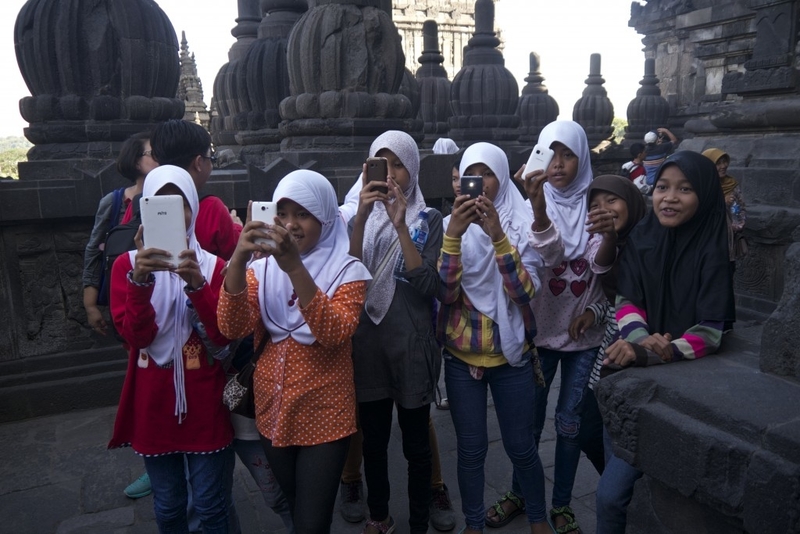 Girls taking my photo in Prambanan