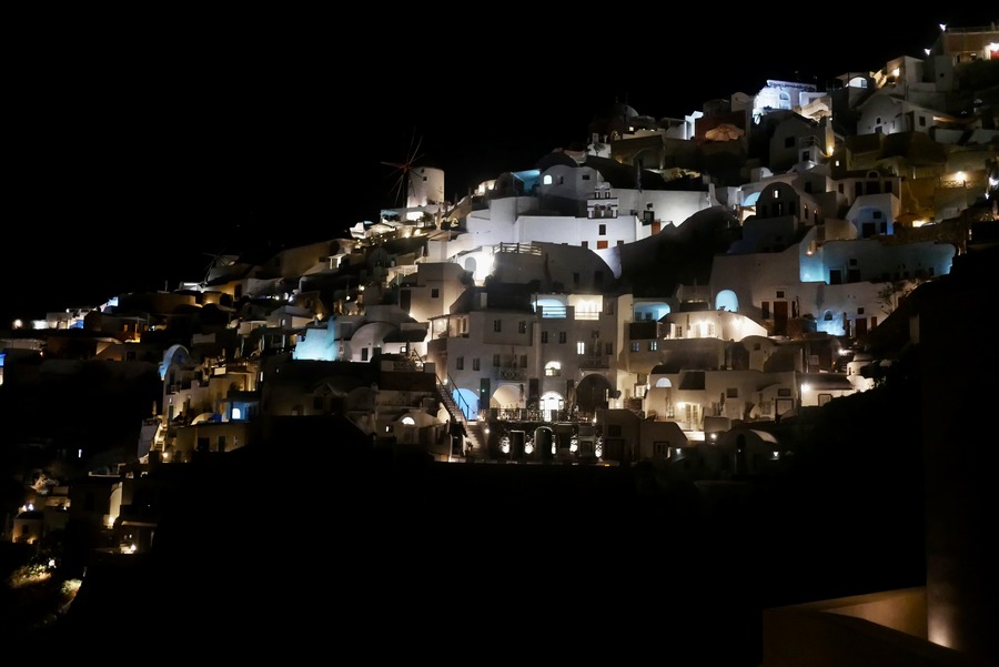 Oia lit up at night