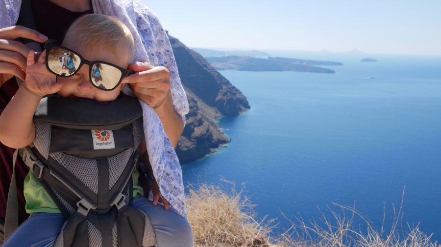 Baby on a sunny hike in Santorini Greece