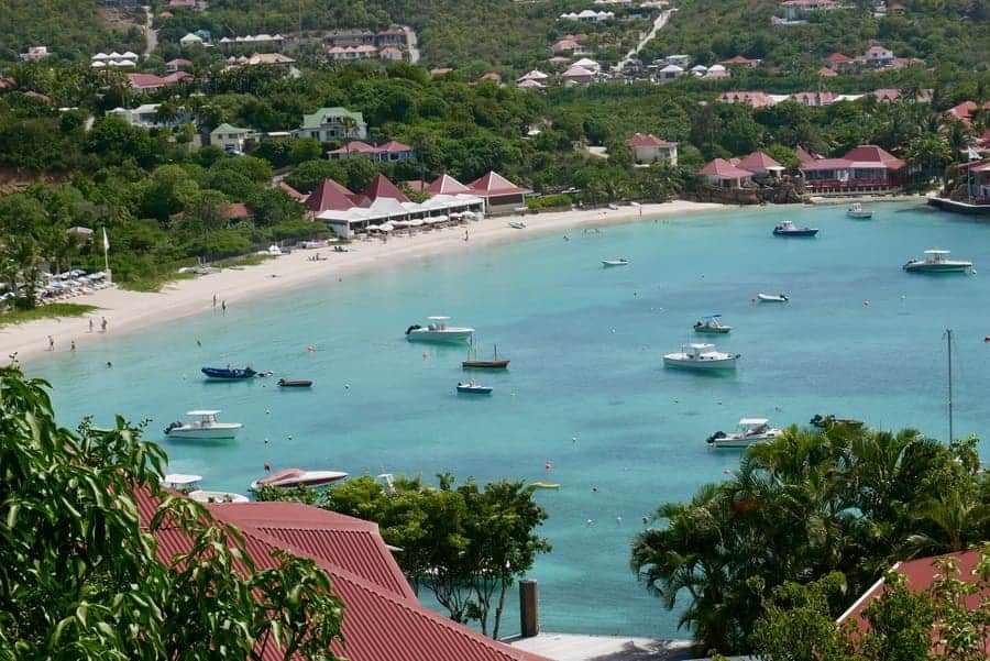 Beautiful St Barths bay with boats and turquoise waters from St Maarten day trip.